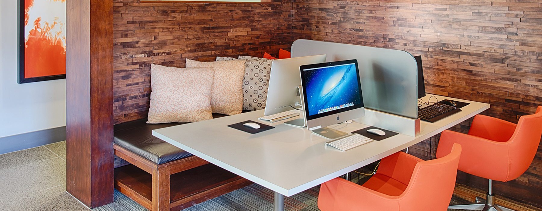 a co-working area with a table and chairs