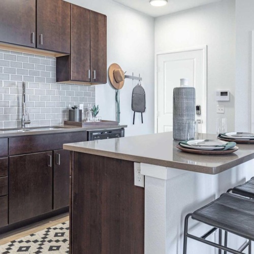 a kitchen with wooden cabinets