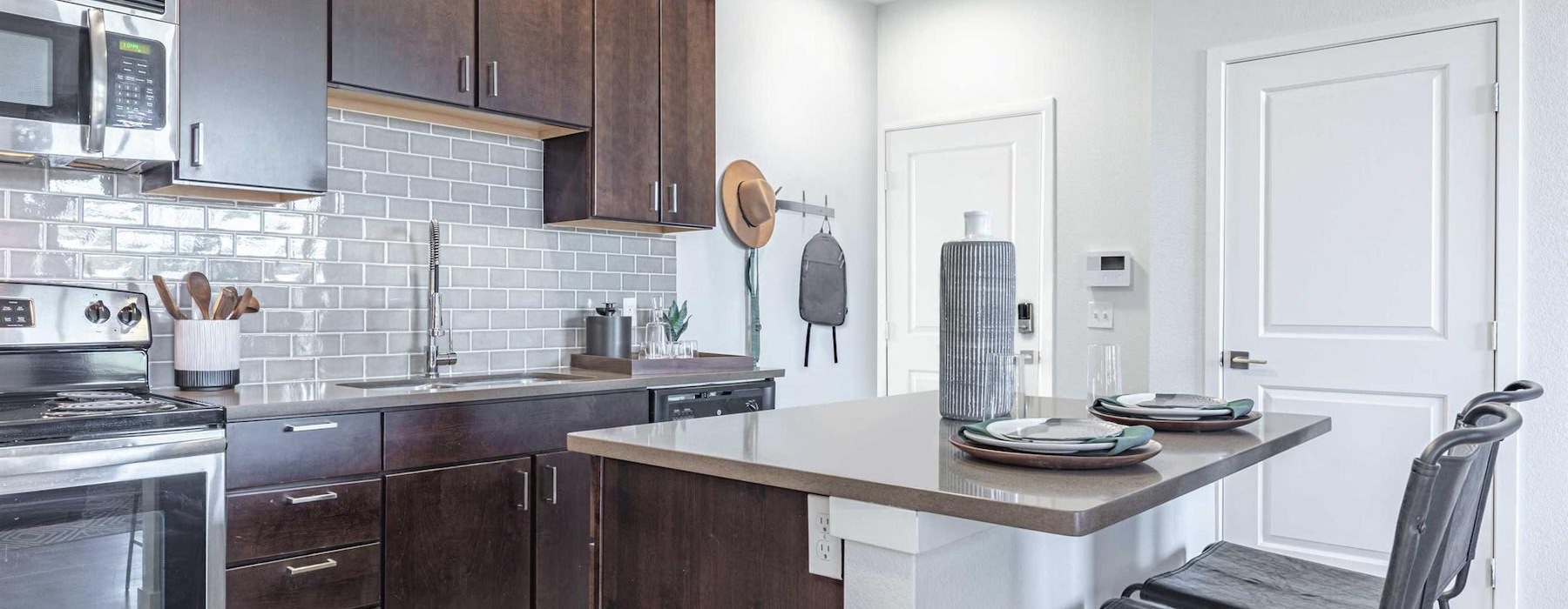 a kitchen with wooden cabinets
