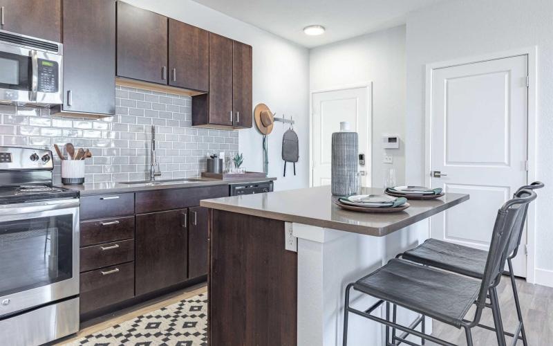 a kitchen with wooden cabinets